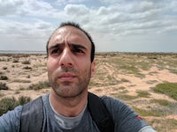 a man taking a selfie in the desert